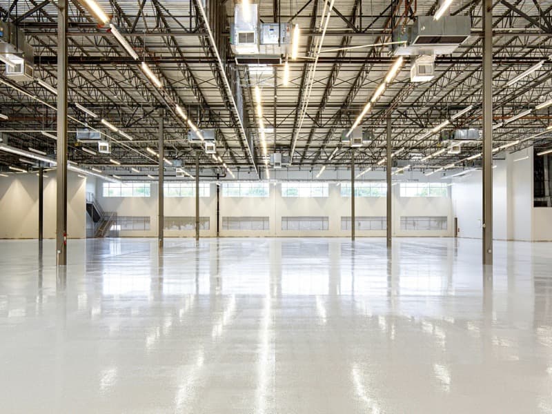 Industrial painting Brisbane, large warehouse with professionally coated epoxy floor