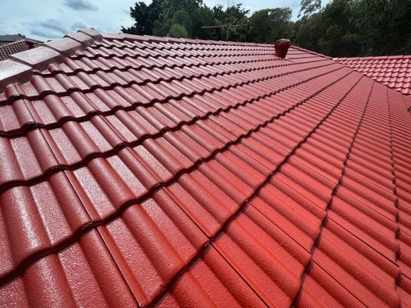 Roof painting Brisbane, freshly coated red terracotta tile roof